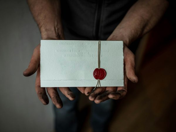 person holding white mail