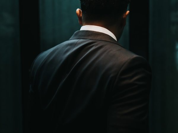 man in black suit jacket